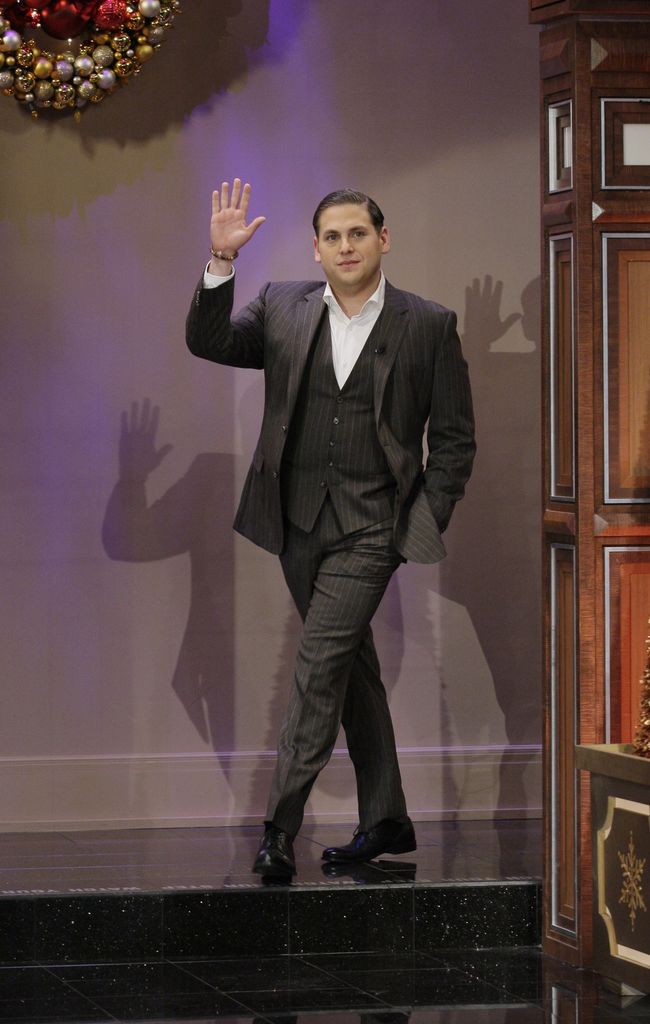jonah hill suit walking and waving