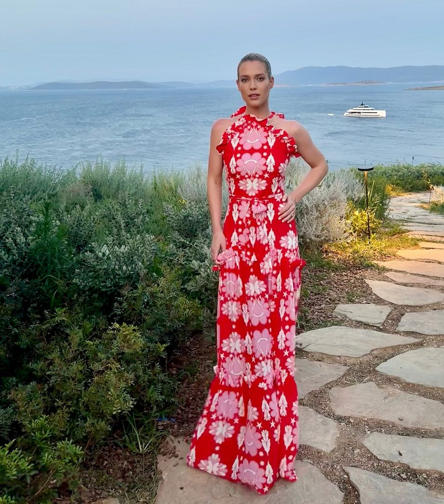 Amelia spencer at sunset in red patterned dress