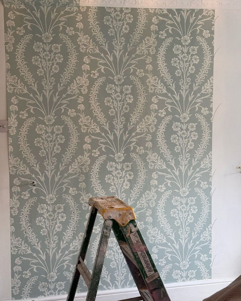 Shirlie Kemp's green and white floral wallpaper with a stepladder in front