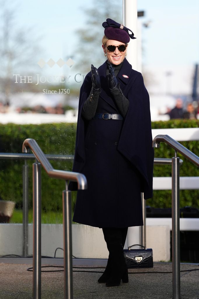 Zara Tindall in navy caped coat at Cheltenham Racecourse