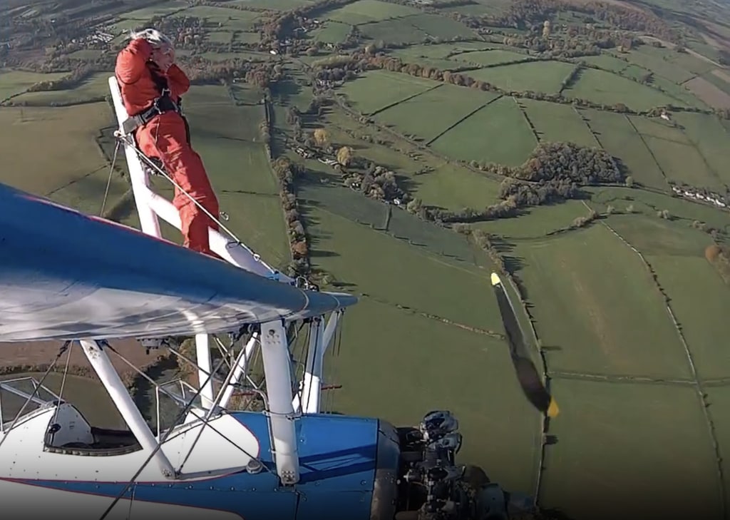 Penny Newton-Hurley wing walking in a red jumpsuit