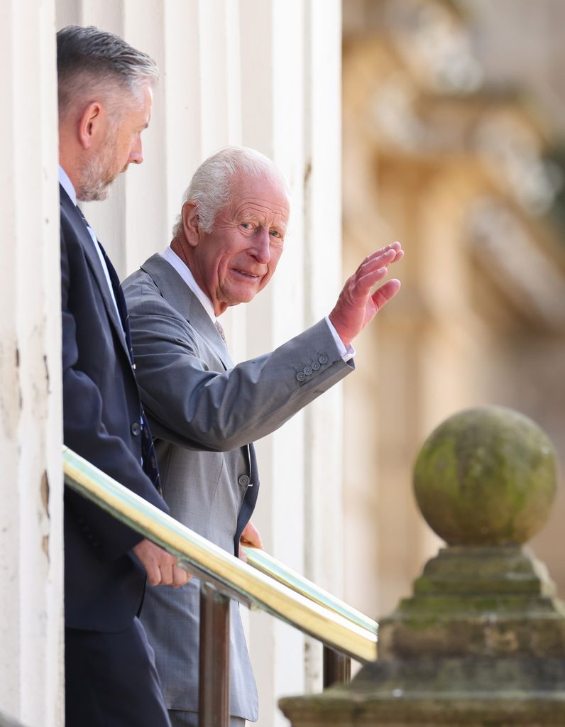 charles waving at well-wishers 