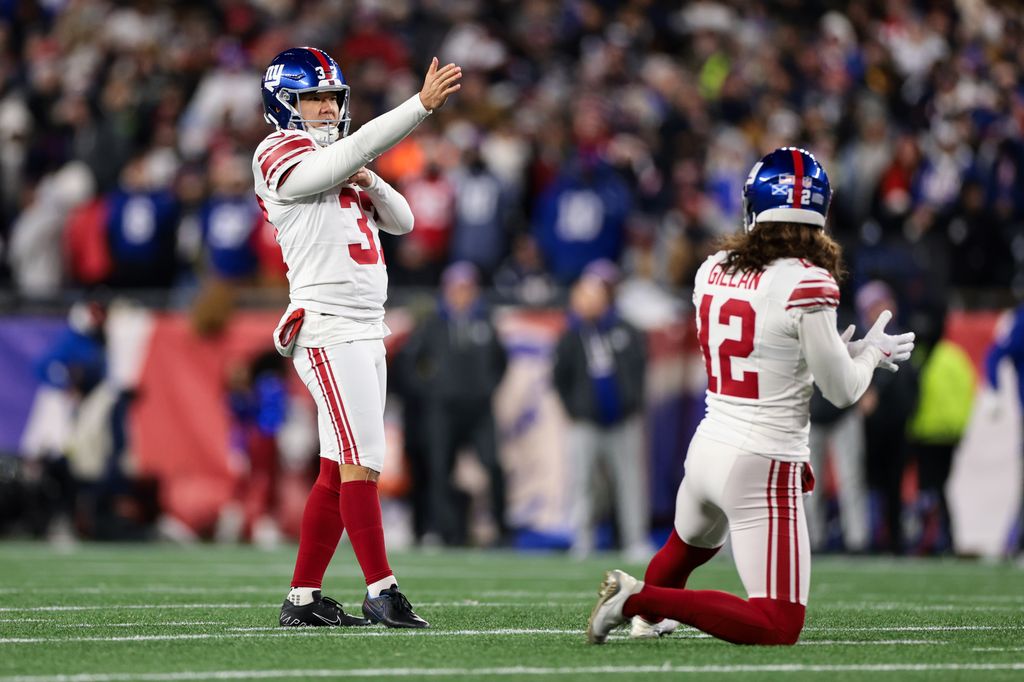 Younghoe Koo #37 of the New York Giants lines up a kick during the second quarter against the New England Patriots