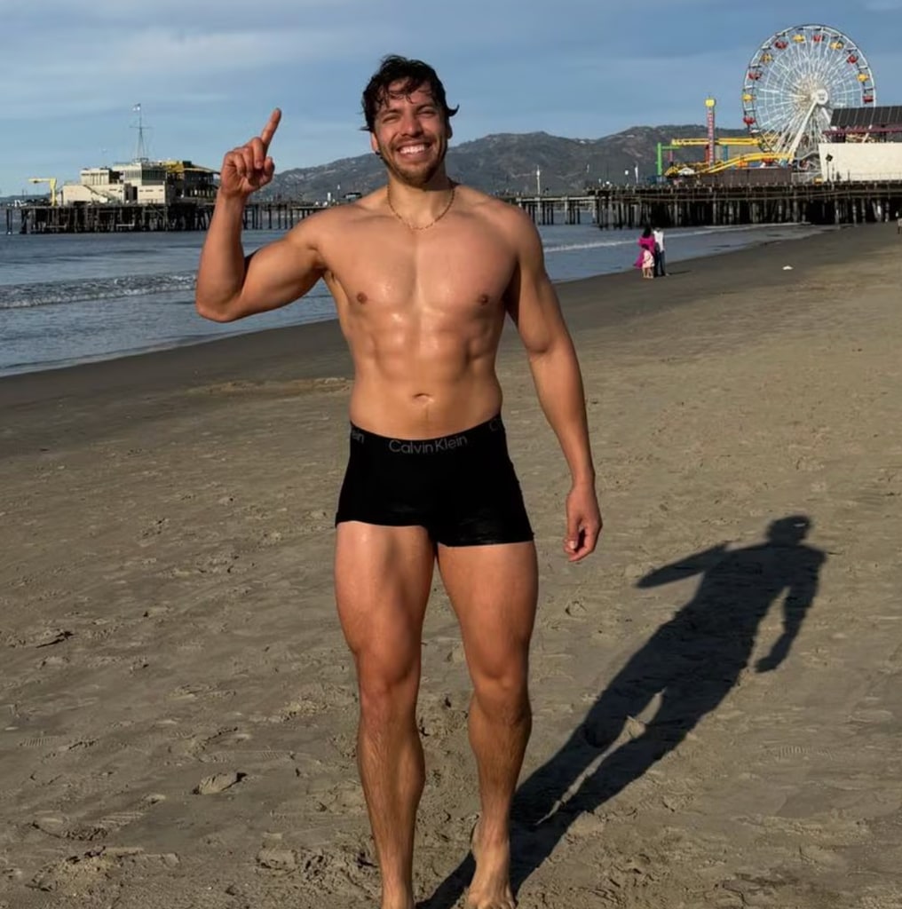 Joseph Baena topless on beach