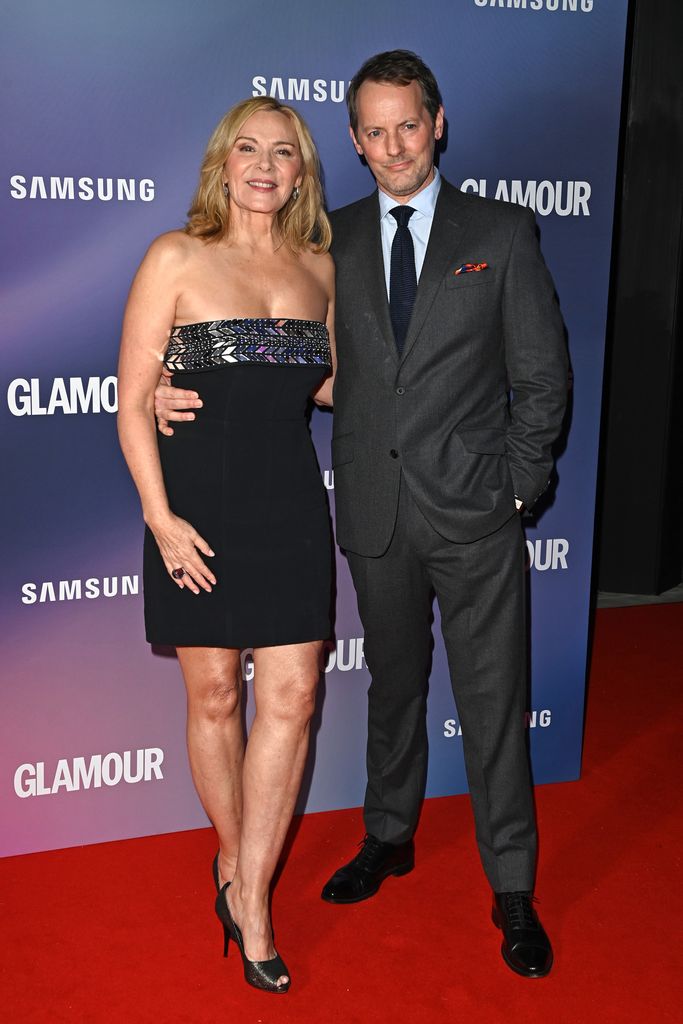 Kim Cattrall and Russell Thomas on a red carpet in 2022