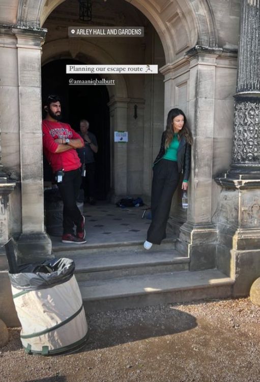 Michelle Keegan and a man stood in the doorway of a country manor