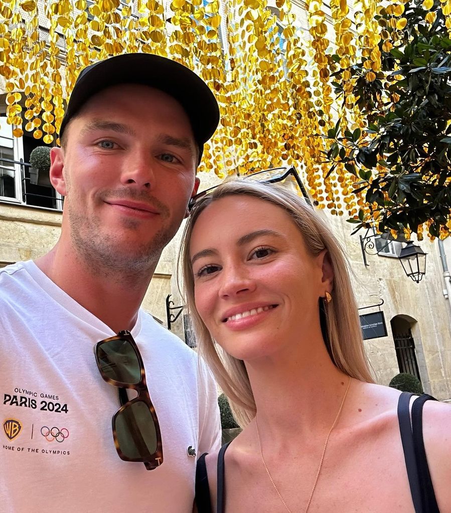 Nicholas Hoult and Bryana Holly taking a selfie