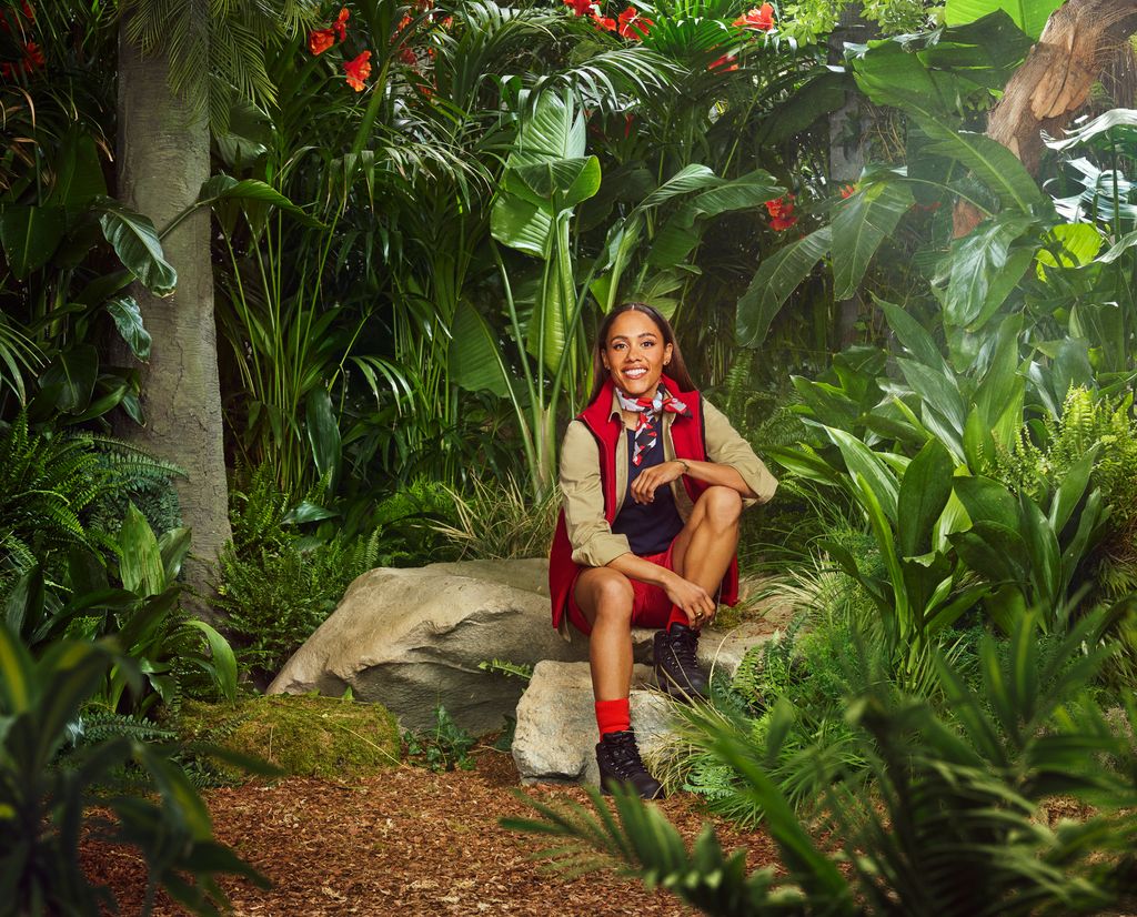 person in red and beige uniform in jungle setting
