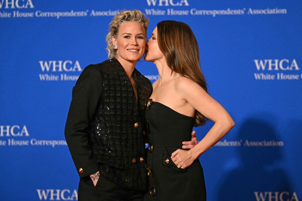 US former football player Ashlyn Harris (L) and US actress Sophia Bush arrive for the White House Correspondents' Association (WHCA) dinner 