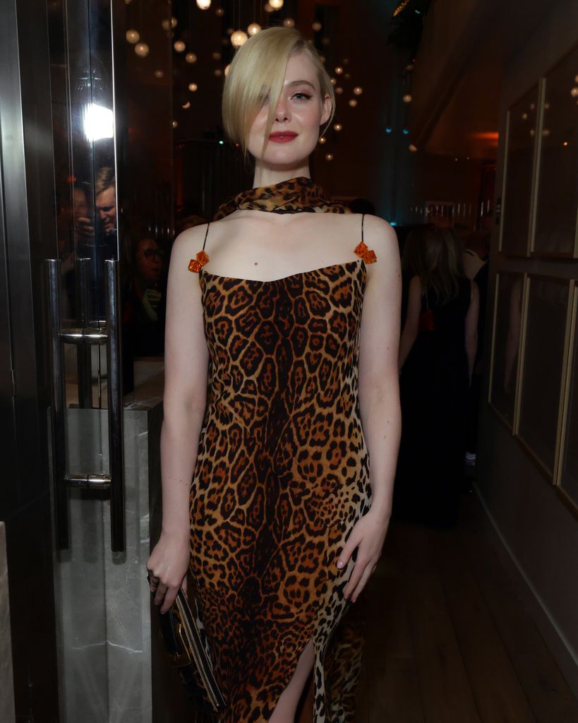 Elle Fanning in a leopard print dress at the golden globes after party