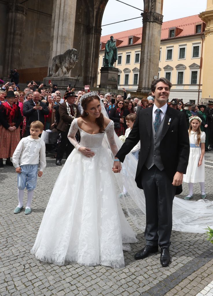 20 May 2023, Bayern, Munich: Ludwig Prince of Bavaria and his wife Sophie-Alexandra Princess of Bavaria come out of the Theatinxerkirche after their church wedding. Around 1,000 guests are expected to attend the festivities. 