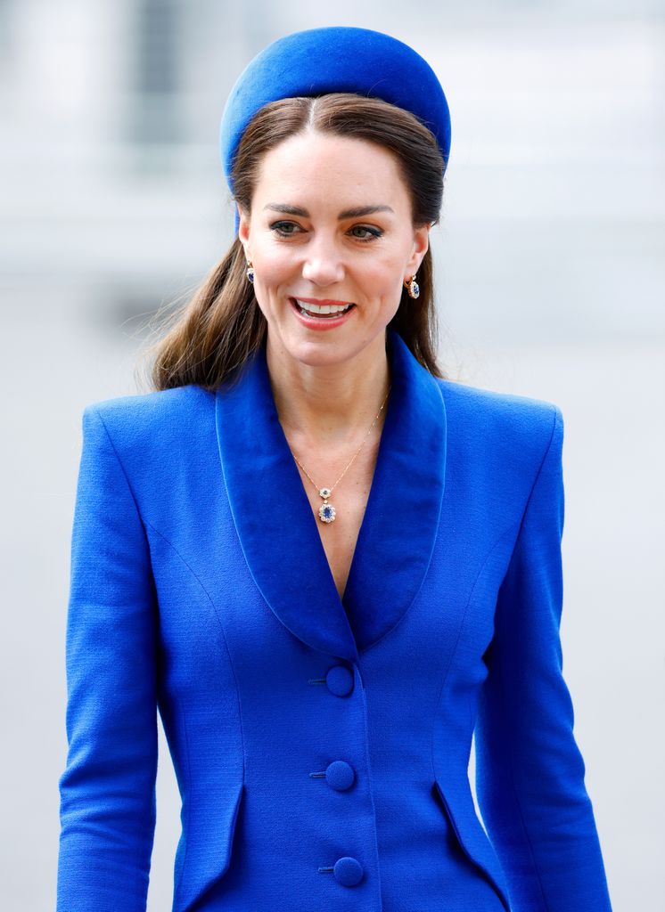 Kate Middleton wears a blue coat and hat