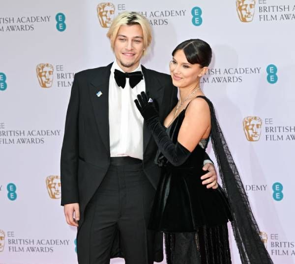 Millie Bobby Brown  and Jake Bongiovi pose at the British Film Awards