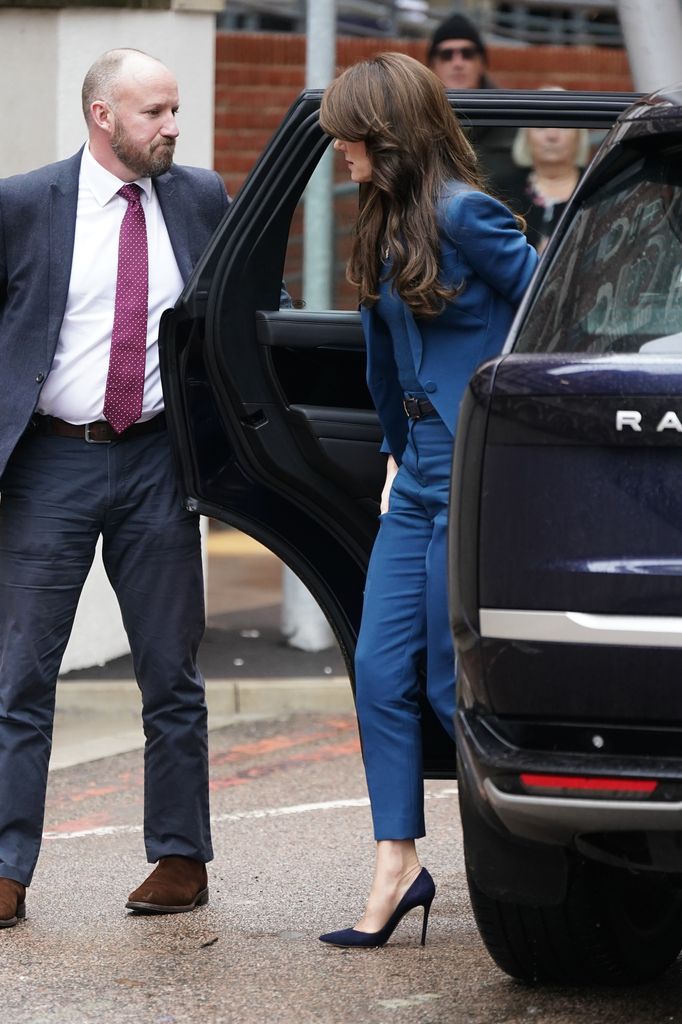 The Princess of Wales exiting car in teal suit