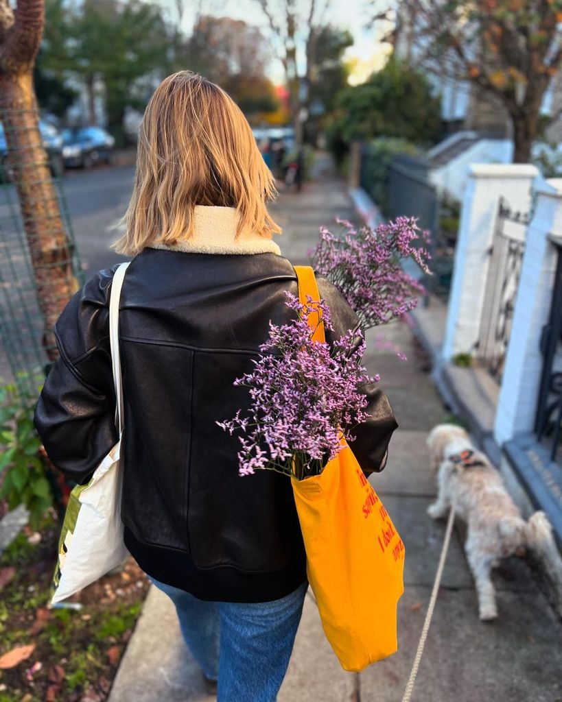 Saoirse Ronan walking with flowers