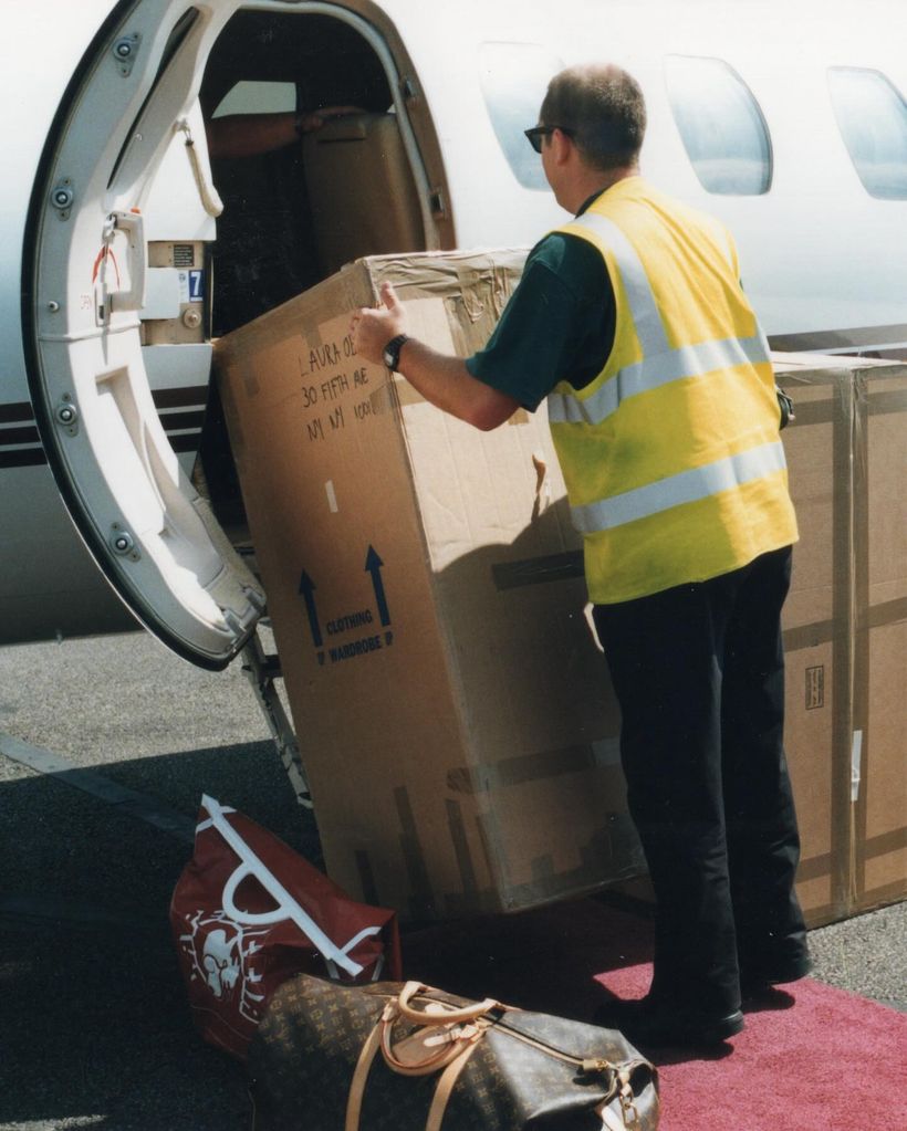 man loading wedding decorations onto the plane