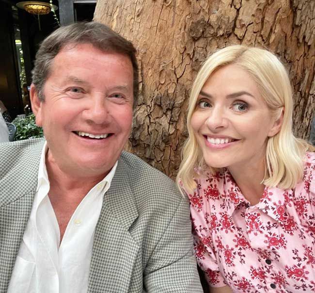 holly willoughby poses with dad