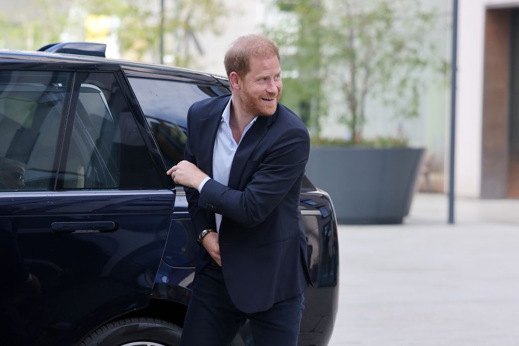 Prince Harry getting out of a car