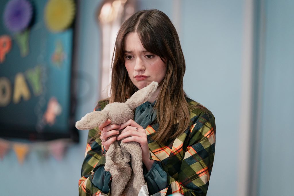 close-up of woman holding toy