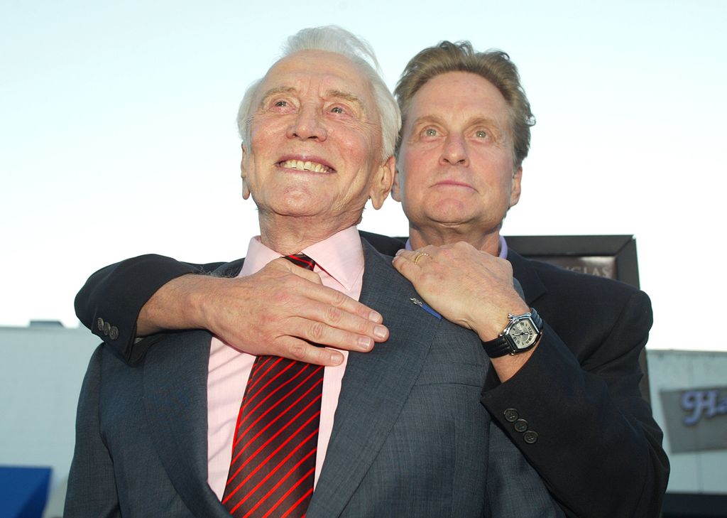 Kirk Douglas and son producer/actor Michael Douglas arrive at the premiere of "It Runs In The Family" at the Bruin Theater on April 7, 2003 in Los Angeles, California.