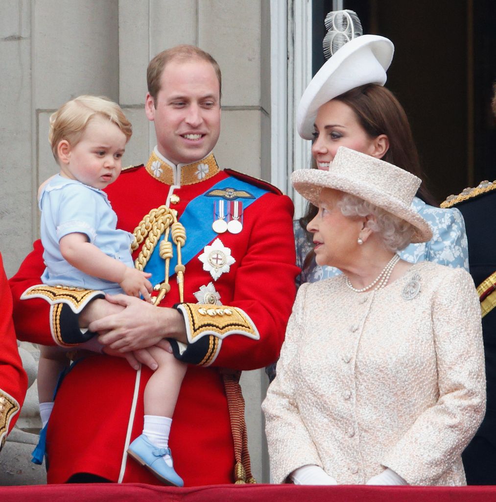 Queen Elizabeth II smiling at Prince George on balcony