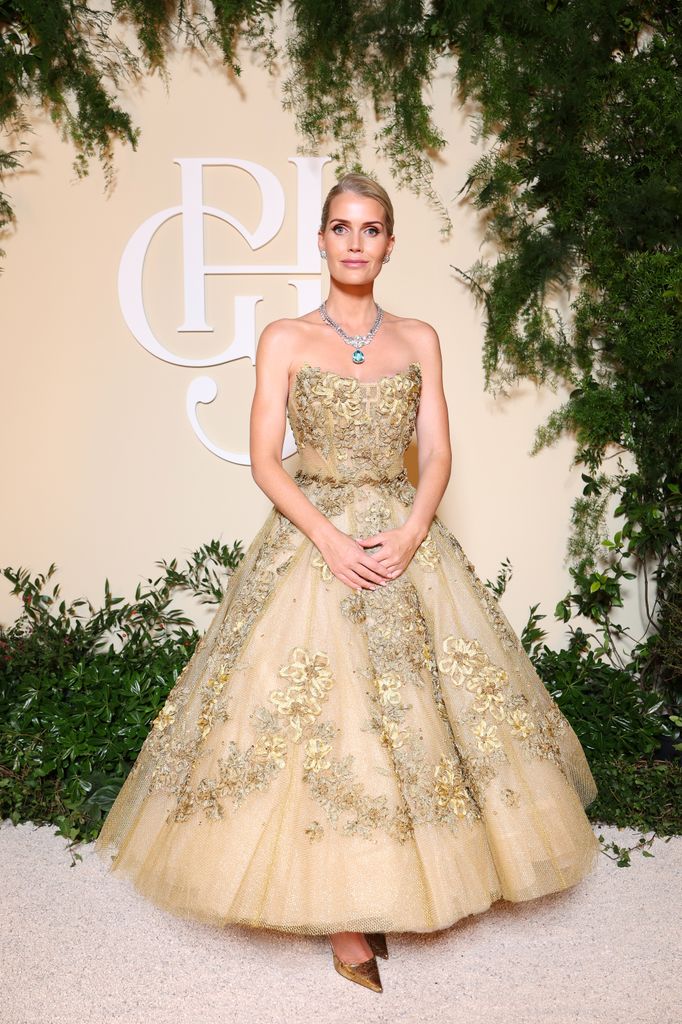 Kitty Spencer posed in gold tulle dress