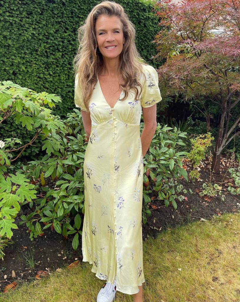 Annabel Croft yellow satin dress with floral print at Wimbledon