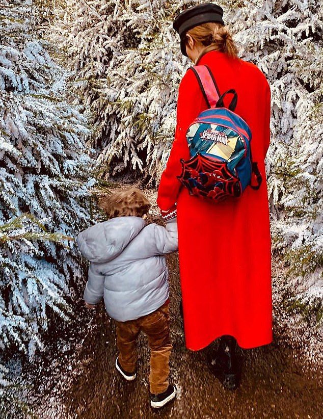 cheryl in snowy trees with bear 