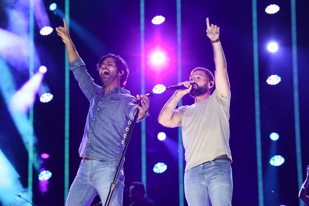 (L-R) Dan Smyers and Shay Mooney of Dan + Shay perform on stage during day one of the CMA Fest 2023 