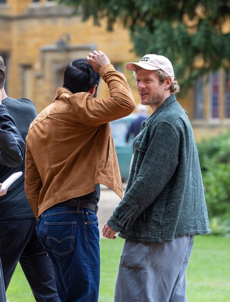 James Norton in pink cap on Grantchester set