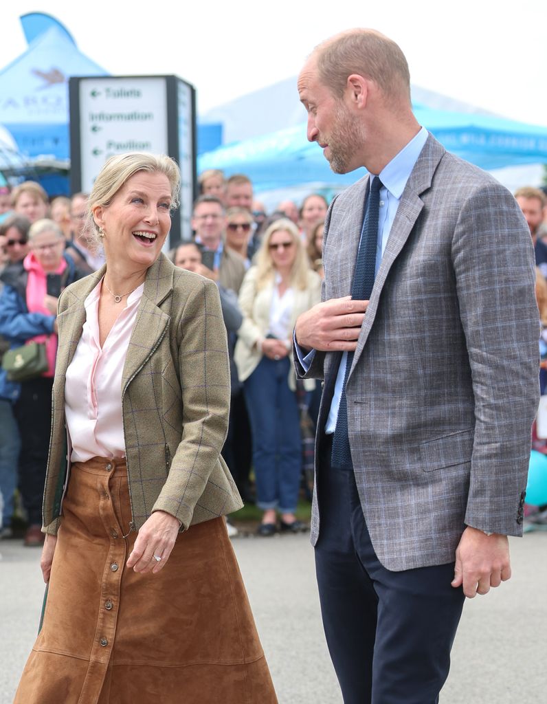 Sophie, Duchess of Edinburgh and Prince William, Prince of Wales, also known as the Duke of Cornwall, share a joke as they attend the Royal Cornwall Show at the Royal Cornwall Showground