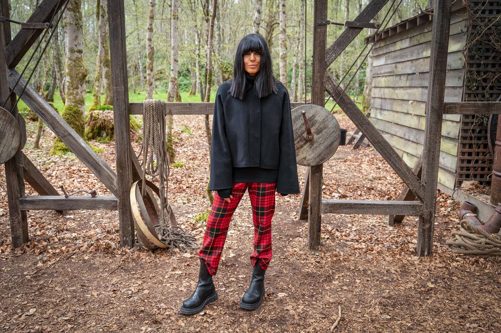 Claudia Winkleman wearing red tartan trousers on Celebrity Traitors