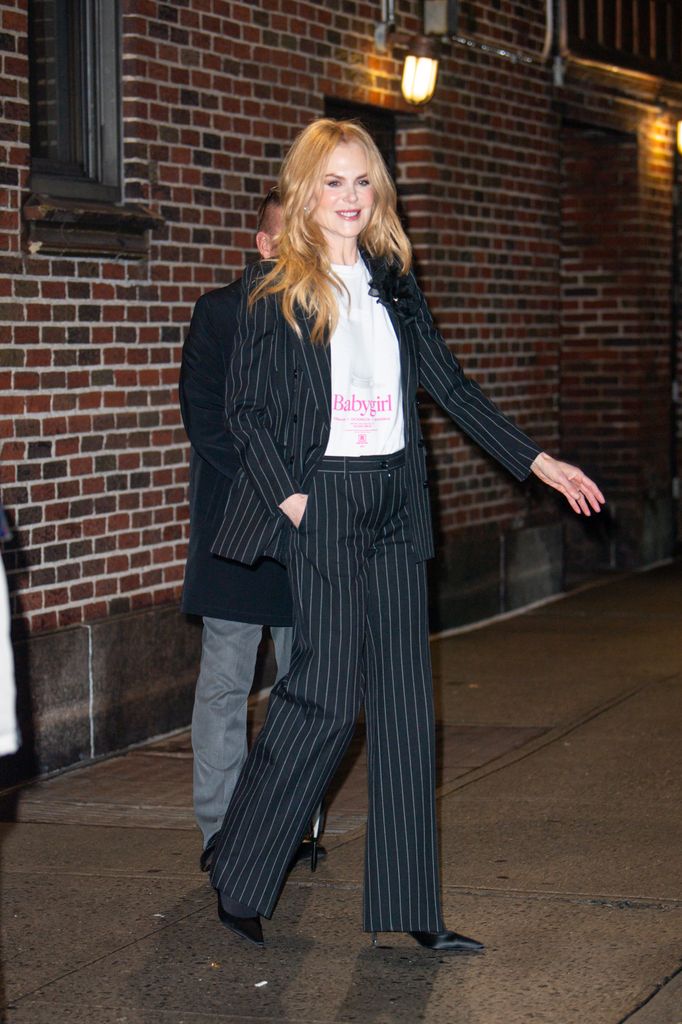 Nicole Kidman in striped suit leaving studio