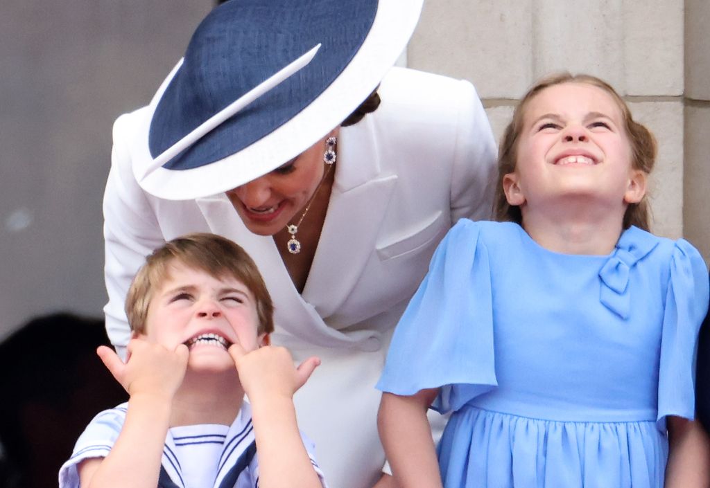 Prince Louis pulls a face as he watches the RAF flypast 