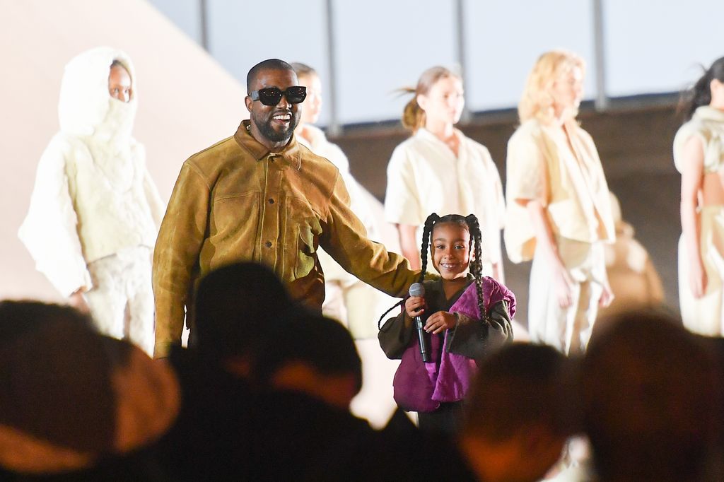 Kanye and North West on stage