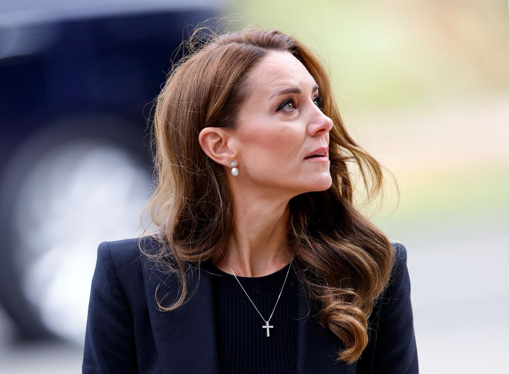 Catherine, Princess of Wales views floral tributes left at the entrance to Sandringham House, the Norfolk estate of Queen Elizabeth II, 