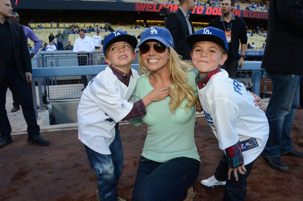 In this handout photo provided by the LA Dodgers, Britney Spears poses with sons Jayden James Federline (L) and Sean Preston Federline (R) during a game against the San Diego Padres at Dodger Stadium on April 17, 2013 in Los Angeles, California.
