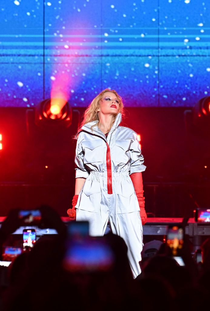Kylie Minogue performing in silver outfit