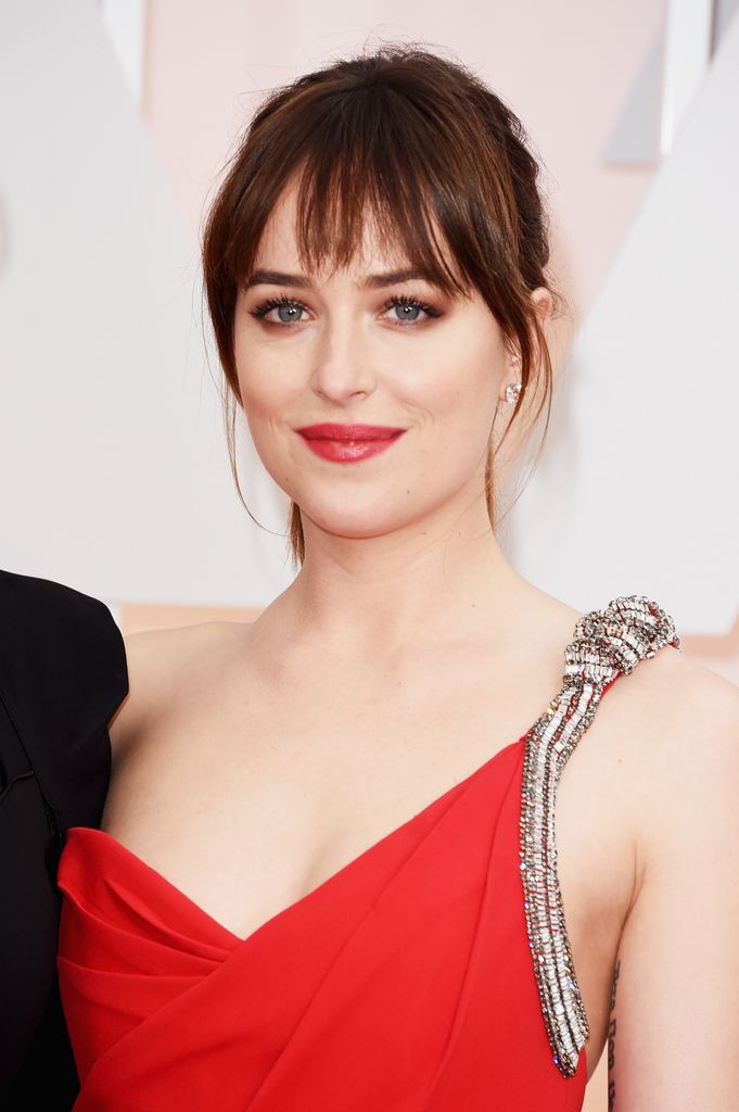 HOLLYWOOD, CA - FEBRUARY 22:  Actress Dakota Johnson attends the 87th Annual Academy Awards at Hollywood & Highland Center on February 22, 2015 in Hollywood, California.  (Photo by Jason Merritt/Getty Images)