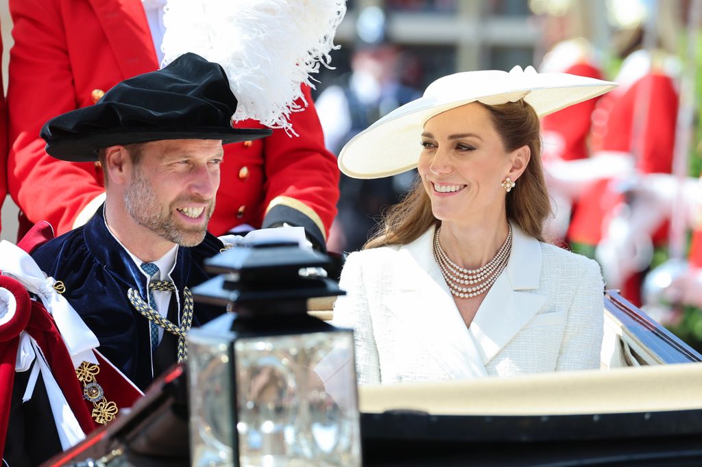 Kate glancing at William in carriage