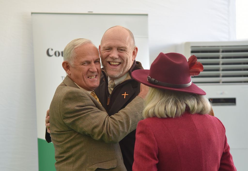 Mike Tindall hugging a friend
