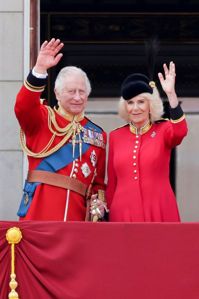 Charles and Camilla waving from palace balcony at Trooping the Colour
