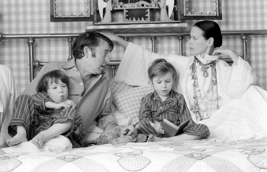 Actor and author Wyatt Emory Cooper, Carter Vanderbilt Cooper, Anderson Cooper, American heiress and socialite Gloria Vanderbilt pose for a family portrait as they play on a bed in their home on March 30, 1972 in Southampton, Long Island, New York
