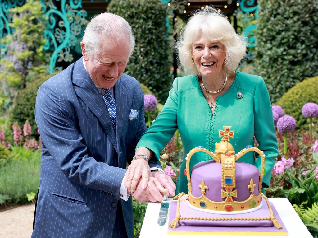 King Charles and Queen Camilla cut coronation cake