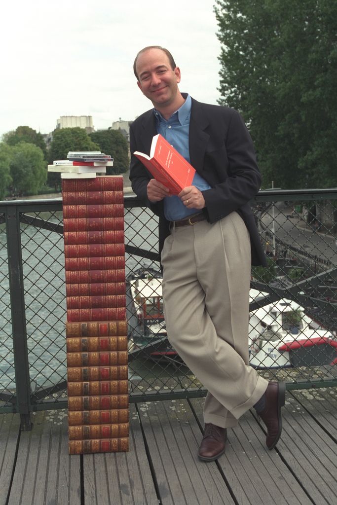 Jeff Bezos holds book on a bridge in France in 2000