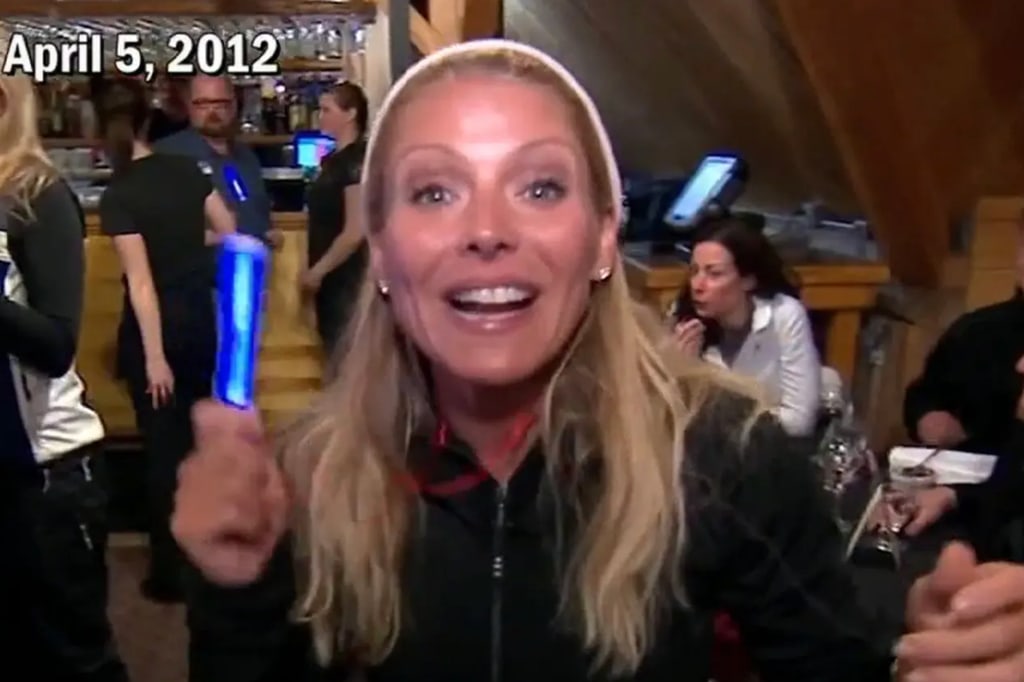 A picture of Kelly Ripa in jumper and white headband from the ski episode 