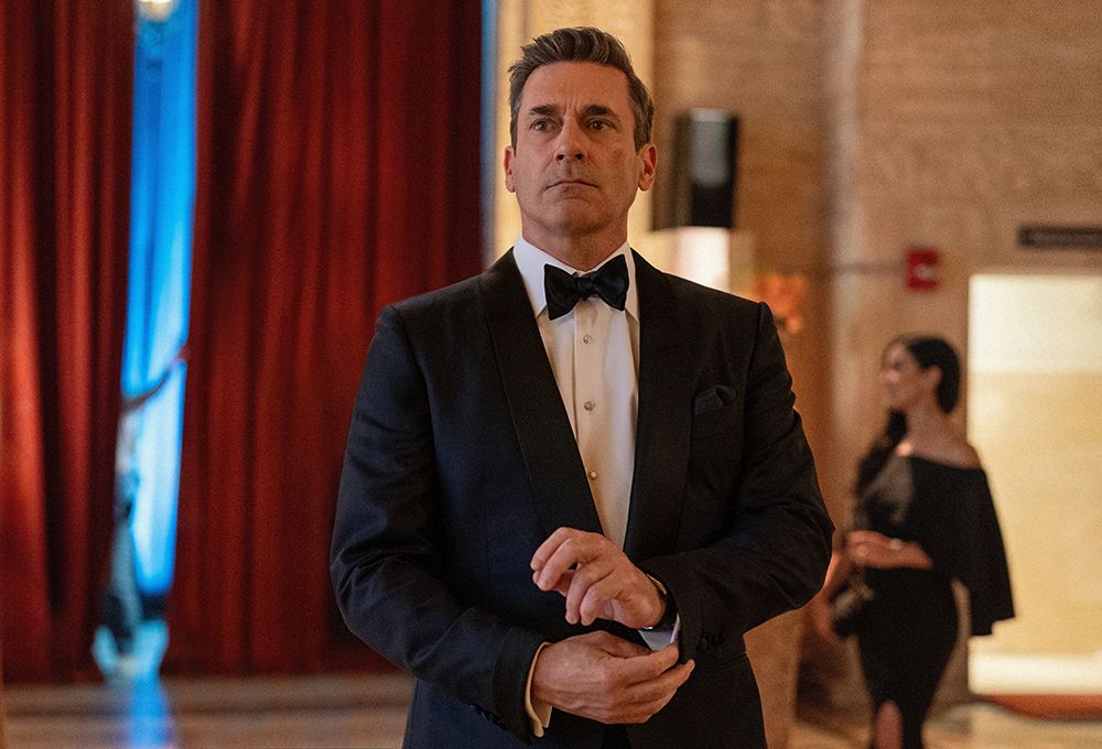 Jon Hamm as Andrew "Coop" Cooper. He is dressed in a tuxedo