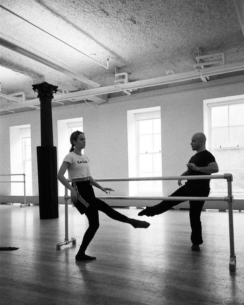 Brie at ballet barre in black and white