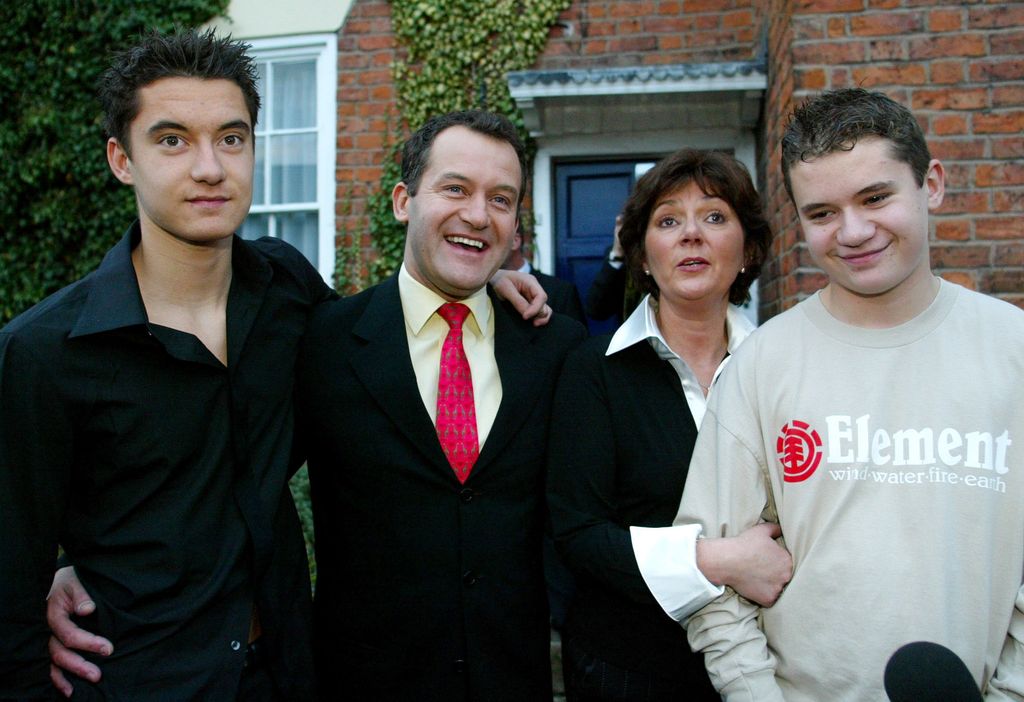 Paul Burrell with his ex-wife Maria and sons Alexander and Nicholas outside their home in Farndon, Cheshire.