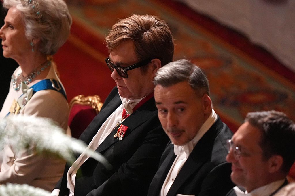 Elton John and his husband David Furnish (2R) attend a State Banquet at Windsor Castle